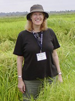 A person standing outdoors in a field